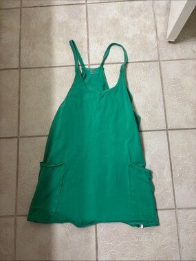 FP Movement green hot shot romper with small rust stain
